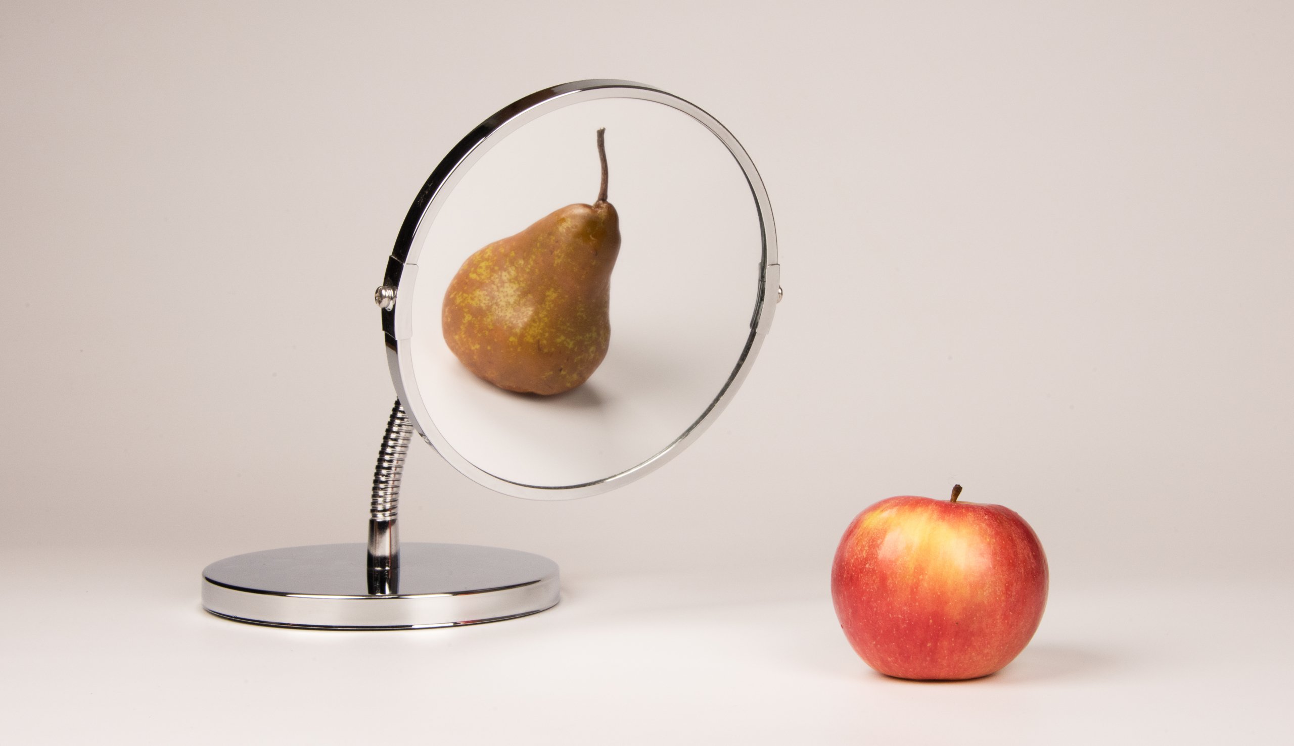 Strange,Mirror,Reflecting,Apple,And,Pear